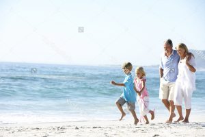 Older Couple with Grandchildren on the beach